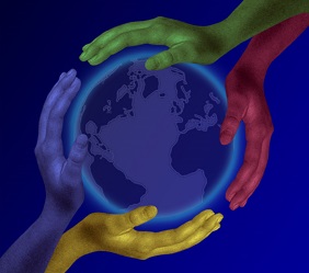 multi colored hands encircle earth globe