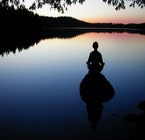 Peacefull meditation in front of lake
